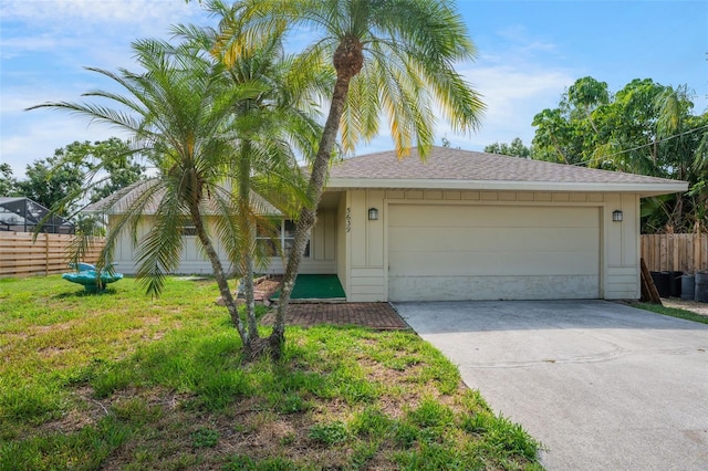 5639 Blount Ave, Sarasota, FL 34231 - ranch-style house featuring driveway, a garage, a shingled roof, and board and batten siding