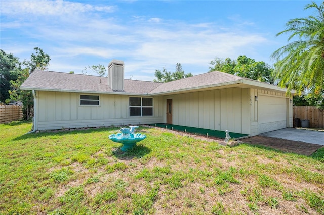 5639 Blount Ave, Sarasota, FL 34231 - back of house featuring a chimney and an attached garage
