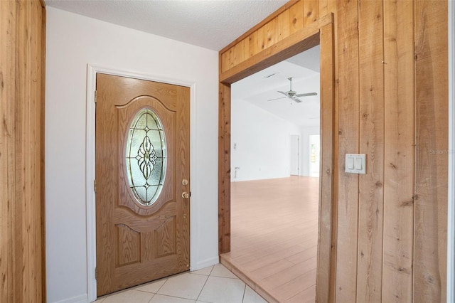5639 Blount Ave, Sarasota, FL 34231 - entrance foyer with ceiling fan, light tile patterned floors, and healthy amount of natural light