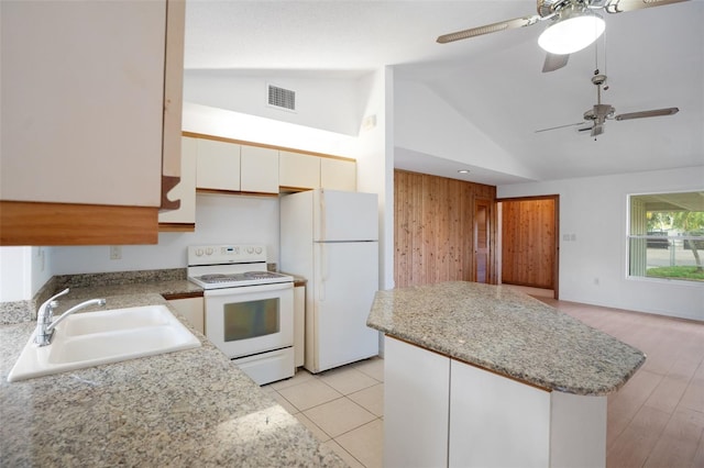 5639 Blount Ave, Sarasota, FL 34231 - kitchen featuring white appliances, a sink, a ceiling fan, a kitchen island, and white cabinetry