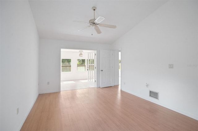 5639 Blount Ave, Sarasota, FL 34231 - empty room with ceiling fan, light wood-style flooring, lofted ceiling, and baseboards