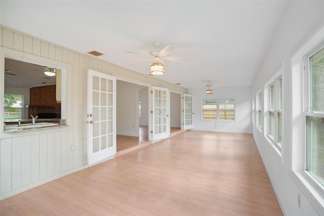 5639 Blount Ave, Sarasota, FL 34231 - unfurnished sunroom featuring french doors and plenty of natural light