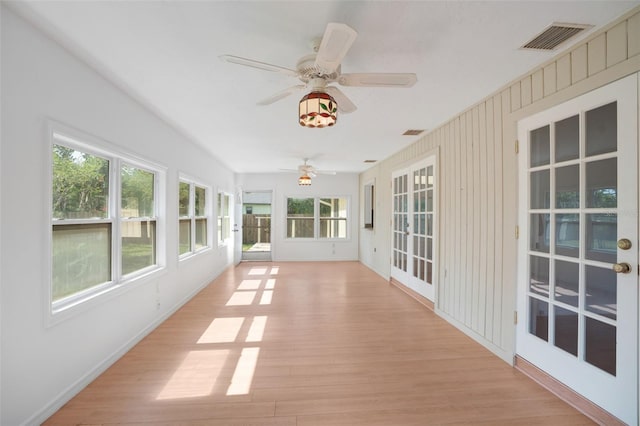 5639 Blount Ave, Sarasota, FL 34231 - unfurnished sunroom with wood finished floors and baseboards