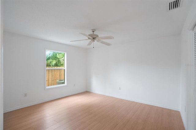 5639 Blount Ave, Sarasota, FL 34231 - spare room with a ceiling fan, light wood-style flooring, and baseboards