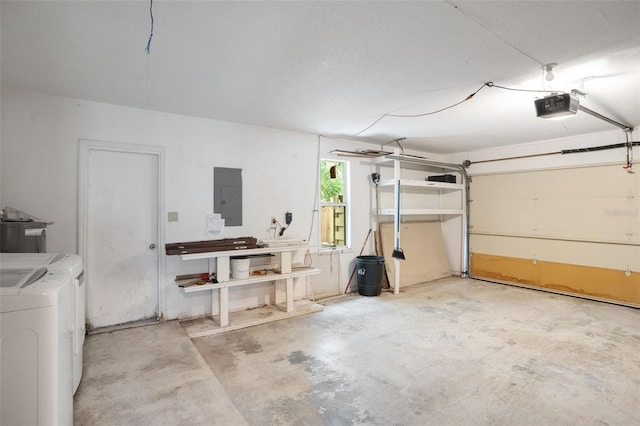 5639 Blount Ave, Sarasota, FL 34231 - garage featuring electric panel, washing machine and dryer, and a garage door opener