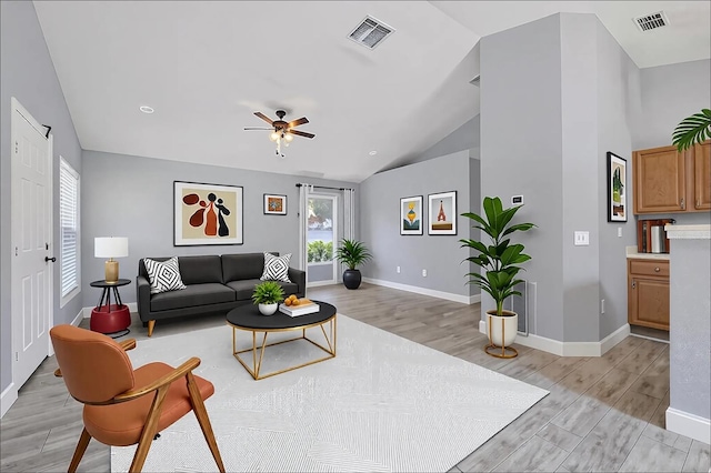 3429 97th Ln E, Palmetto, FL 34221 - living area featuring light wood-type flooring, a ceiling fan, baseboards, and high vaulted ceiling