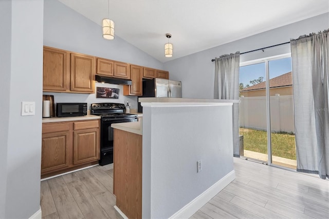 3429 97th Ln E, Palmetto, FL 34221 - kitchen with black appliances, under cabinet range hood, lofted ceiling, light countertops, and light wood-style flooring