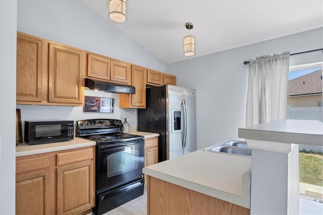 3429 97th Ln E, Palmetto, FL 34221 - kitchen with black appliances, under cabinet range hood, lofted ceiling, light countertops, and light wood finished floors
