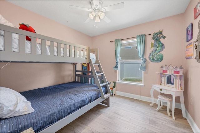 3429 97th Ln E, Palmetto, FL 34221 - bedroom featuring wood finished floors, baseboards, and ceiling fan