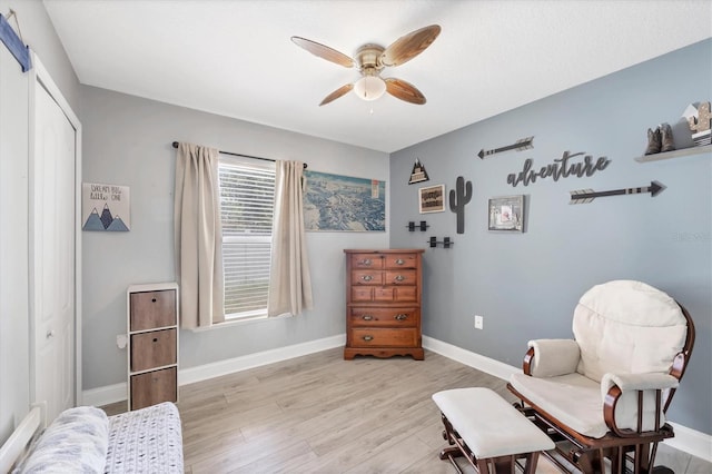 3429 97th Ln E, Palmetto, FL 34221 - sitting room featuring a ceiling fan, light wood finished floors, and baseboards