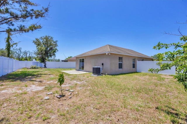 3429 97th Ln E, Palmetto, FL 34221 - rear view of house featuring central air condition unit, stucco siding, and a patio area