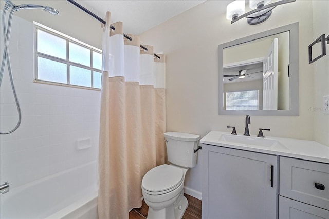 2953 Oak St, Sarasota, FL 34237 - bathroom featuring toilet, vanity, shower / tub combo with curtain, and wood finished floors