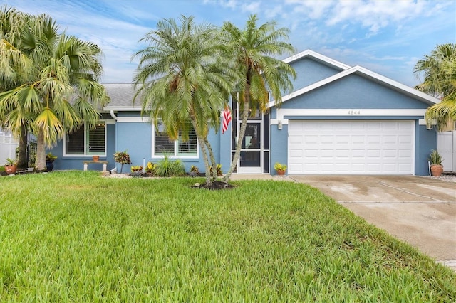 4844 14th Ave E, Bradenton, FL 34208 - ranch-style home featuring stucco siding, concrete driveway, an attached garage, and a front lawn