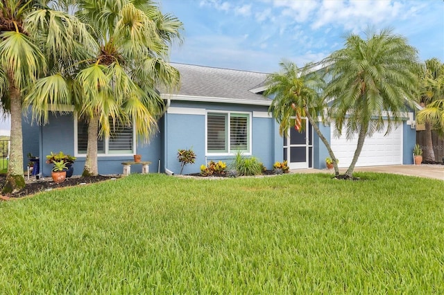 4844 14th Ave E, Bradenton, FL 34208 - view of front of house with driveway, a garage, stucco siding, a front yard, and a shingled roof