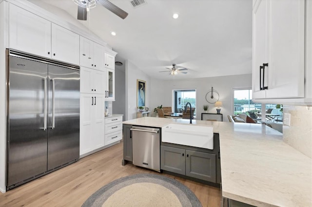 4844 14th Ave E, Bradenton, FL 34208 - kitchen with appliances with stainless steel finishes, a ceiling fan, a sink, a peninsula, and recessed lighting