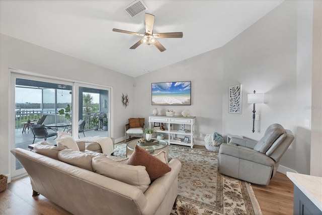 4844 14th Ave E, Bradenton, FL 34208 - living area featuring lofted ceiling, light wood-type flooring, a ceiling fan, and baseboards