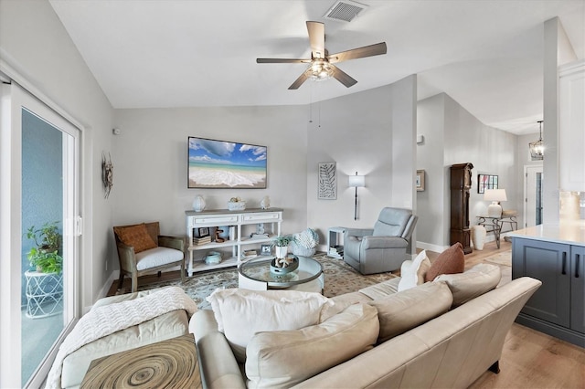 4844 14th Ave E, Bradenton, FL 34208 - living area featuring lofted ceiling, a ceiling fan, light wood-style flooring, and baseboards
