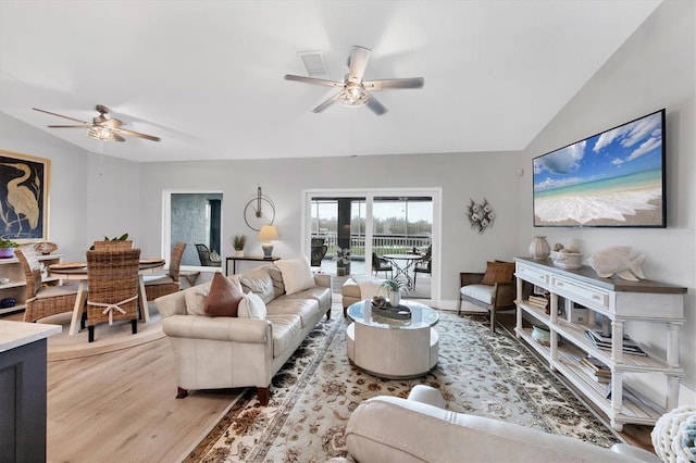 4844 14th Ave E, Bradenton, FL 34208 - living area featuring a ceiling fan, light wood finished floors, and vaulted ceiling