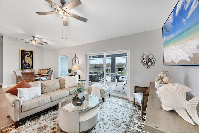 4844 14th Ave E, Bradenton, FL 34208 - living area with ceiling fan, baseboards, and wood finished floors