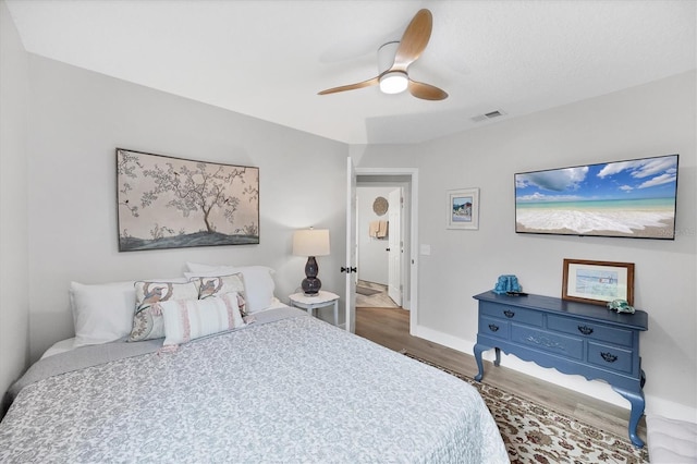 4844 14th Ave E, Bradenton, FL 34208 - bedroom featuring wood finished floors, baseboards, and a ceiling fan