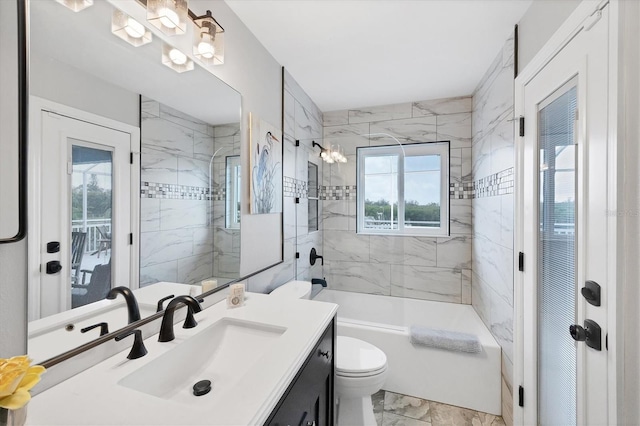 4844 14th Ave E, Bradenton, FL 34208 - full bathroom with plenty of natural light, vanity, toilet, and marble look tile flooring