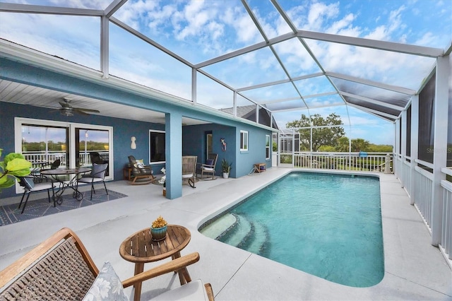 4844 14th Ave E, Bradenton, FL 34208 - view of swimming pool featuring a ceiling fan, a patio area, an outdoor living space, and a lanai