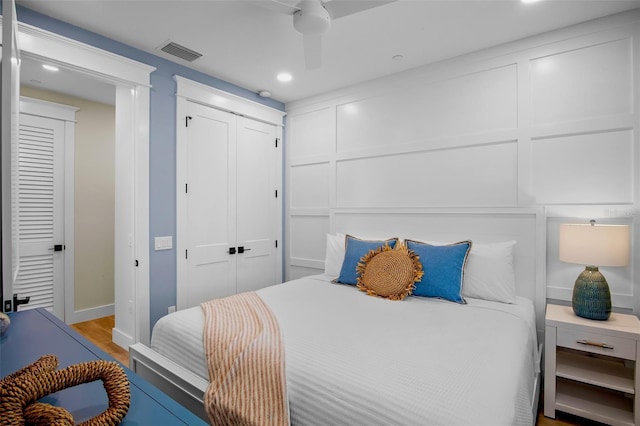 135 Avenida Veneccia, Sarasota, FL 34242 - bedroom with recessed lighting, wood finished floors, a closet, and ceiling fan