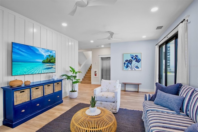 135 Avenida Veneccia, Sarasota, FL 34242 - living area featuring a ceiling fan, stairway, recessed lighting, light wood finished floors, and elevator