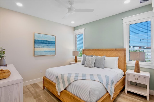 135 Avenida Veneccia, Sarasota, FL 34242 - bedroom featuring multiple windows, light wood finished floors, recessed lighting, and ceiling fan
