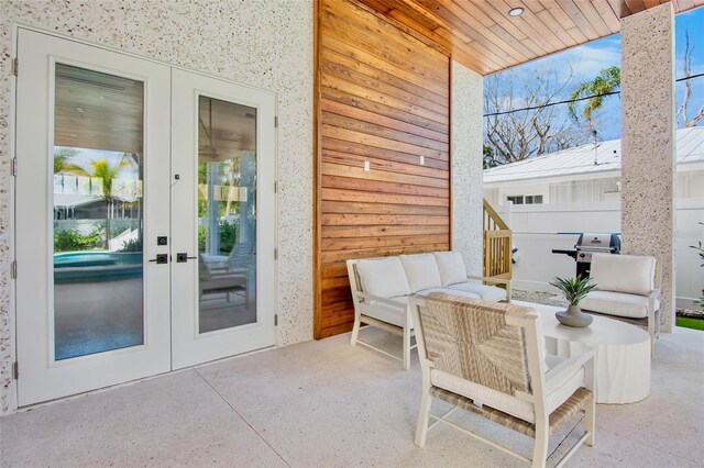 135 Avenida Veneccia, Sarasota, FL 34242 - view of patio / terrace with french doors, an outdoor hangout area, and area for grilling