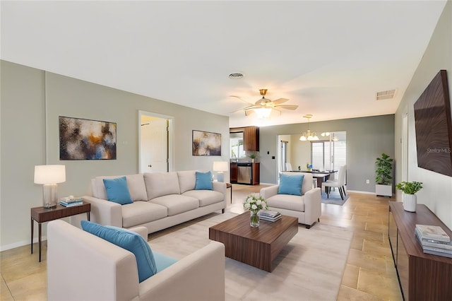 4375 Tortoise Rd, Venice, FL 34293 - living room with a chandelier, a ceiling fan, and baseboards