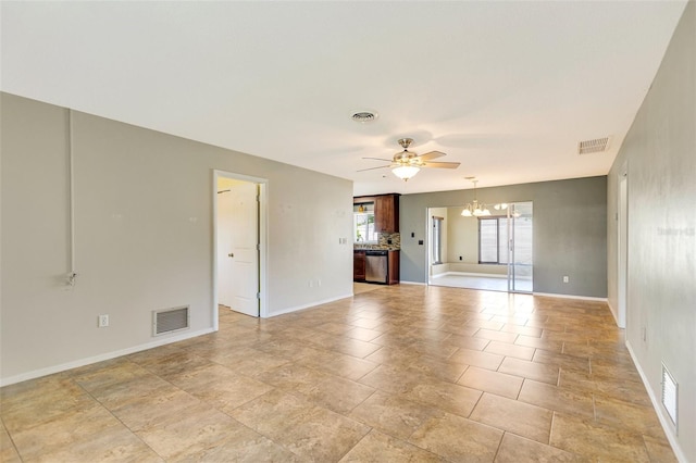 4375 Tortoise Rd, Venice, FL 34293 - unfurnished living room featuring a chandelier, ceiling fan, and baseboards