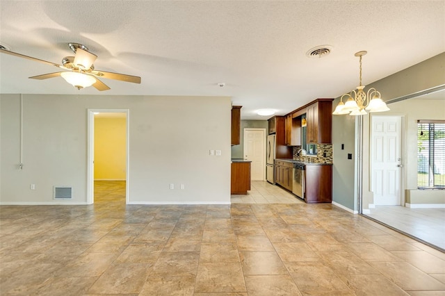 4375 Tortoise Rd, Venice, FL 34293 - kitchen featuring open floor plan, appliances with stainless steel finishes, a chandelier, decorative backsplash, and ceiling fan
