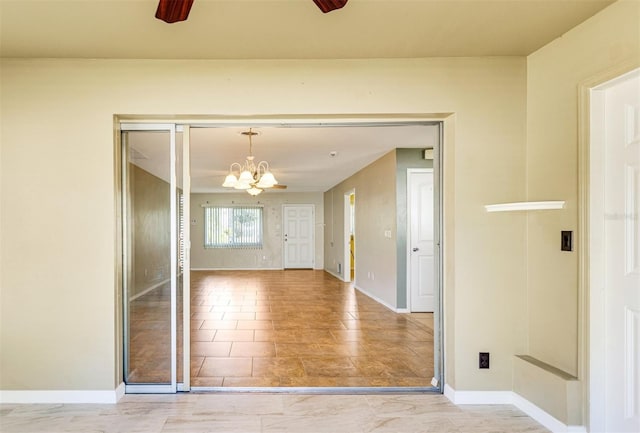 4375 Tortoise Rd, Venice, FL 34293 - spare room with a chandelier, ceiling fan, and baseboards