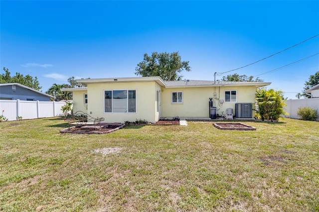 4375 Tortoise Rd, Venice, FL 34293 - rear view of house featuring stucco siding and central AC unit