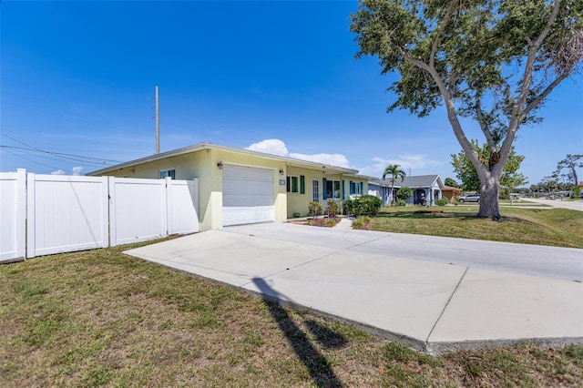 4375 Tortoise Rd, Venice, FL 34293 - ranch-style home featuring an attached garage, concrete driveway, and stucco siding