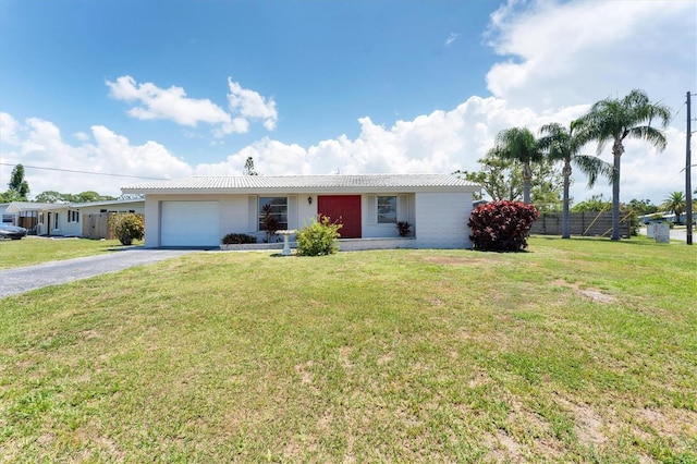 4535 Maceachen Blvd, Sarasota, FL 34233 - single story home with a garage and asphalt driveway