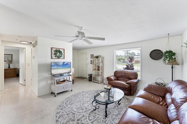 4535 Maceachen Blvd, Sarasota, FL 34233 - living area with baseboards, a ceiling fan, and dark speckled floor