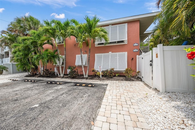 308 Canal Rd, Sarasota, FL 34242 - view of front facade with a gate, uncovered parking, and stucco siding