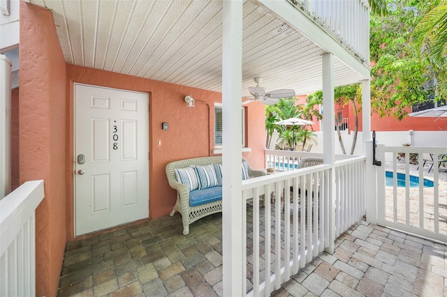 308 Canal Rd, Sarasota, FL 34242 - doorway to property with a ceiling fan and covered porch