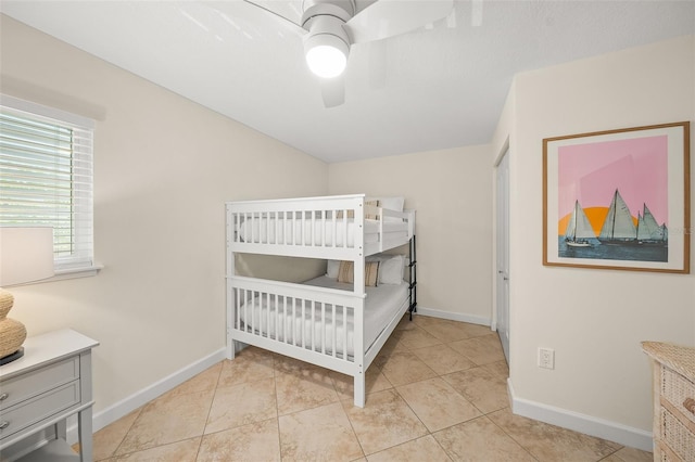 308 Canal Rd, Sarasota, FL 34242 - tiled bedroom with baseboards and a ceiling fan