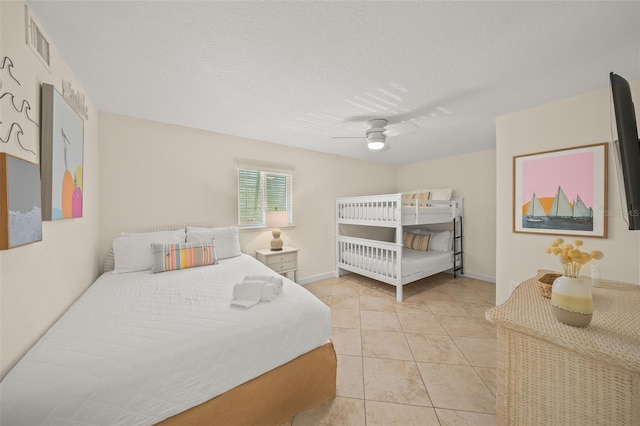 308 Canal Rd, Sarasota, FL 34242 - bedroom with a ceiling fan, light tile patterned flooring, and baseboards