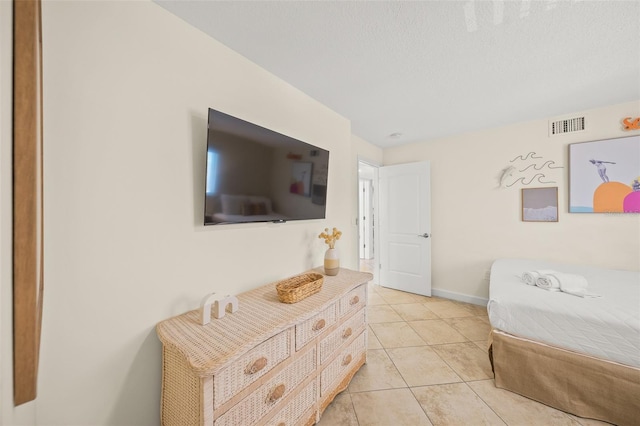 308 Canal Rd, Sarasota, FL 34242 - bedroom with baseboards and light tile patterned flooring