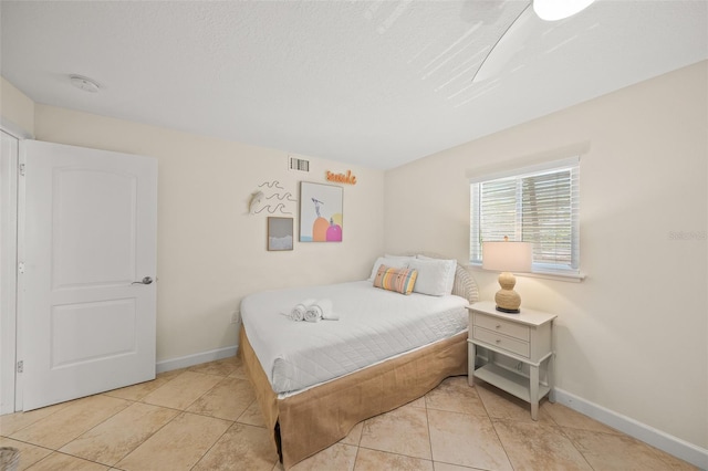 308 Canal Rd, Sarasota, FL 34242 - bedroom with baseboards and light tile patterned flooring
