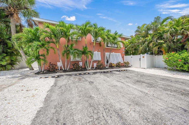 308 Canal Rd, Sarasota, FL 34242 - view of front of house featuring a gate, uncovered parking, and stucco siding