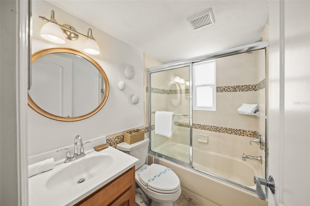 308 Canal Rd, Sarasota, FL 34242 - bathroom with vanity, combined bath / shower with glass door, and toilet