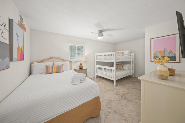 308 Canal Rd, Sarasota, FL 34242 - bedroom featuring ceiling fan, light tile patterned floors, and a textured ceiling