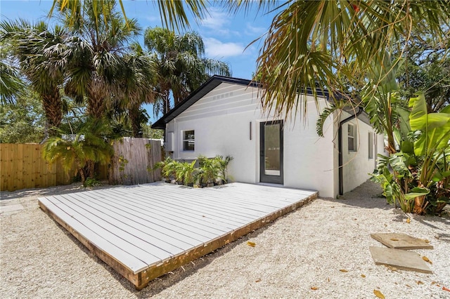 2410 Floyd St, Sarasota, FL 34239 - rear view of property with a deck and stucco siding