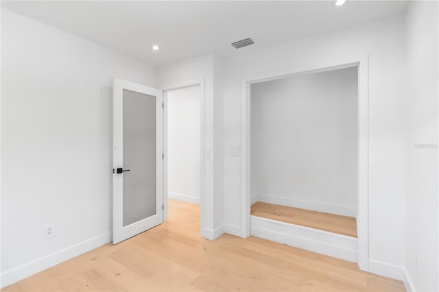 2410 Floyd St, Sarasota, FL 34239 - unfurnished bedroom featuring recessed lighting and light wood finished floors