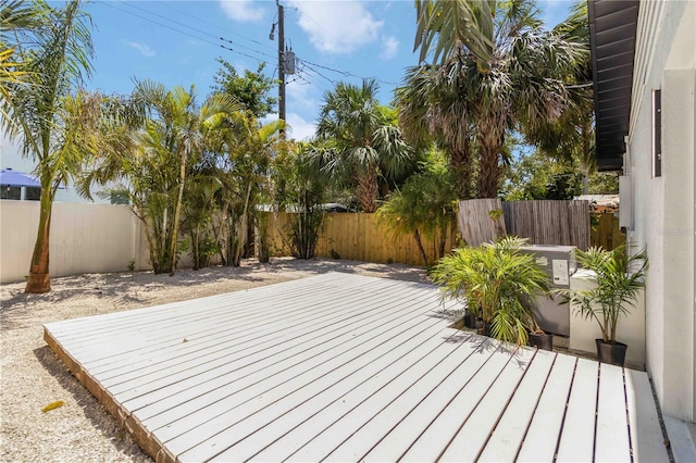 2410 Floyd St, Sarasota, FL 34239 - wooden terrace featuring a fenced backyard